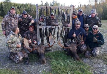 Group Of Moose Hunter With Mooses