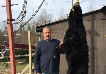 Man With A Black Bear