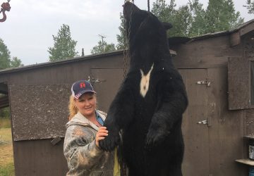 Woman With Hunted Black Bear